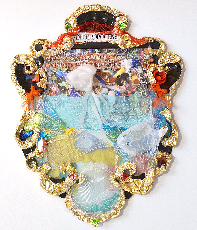 'A mixed media organic shaped wall piece with trash and other elements that present a relief on the wall'
